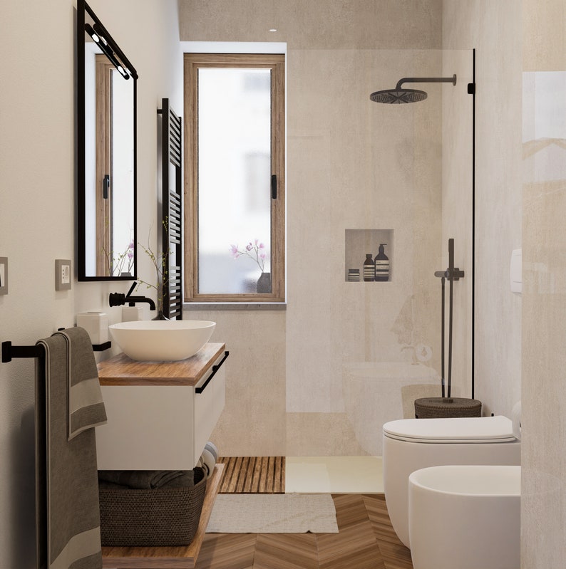 Puede incluir: Un ba&ntilde;o moderno con un lavabo y un tocador blancos, un toallero negro, una ducha con puerta de vidrio y un inodoro blanco. El ba&ntilde;o tiene un suelo de madera y una ventana con vistas a los &aacute;rboles.