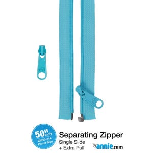Può includere: Cerniera divisibile Parrot Blue da 127 cm con cursore singolo ed extra tirante. La cerniera è di un turchese brillante e include un tirante abbinato. Il testo "by annie.com" è visibile.