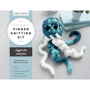 May include: A finger knitting kit for a jellyfish, featuring a blue, teal, and white plush jellyfish toy. The packaging includes the text: Sab's Stuffies, Super Simple Finger Knitting Kit, Jiggle the Jellyfish, Everything You Need Is Included.