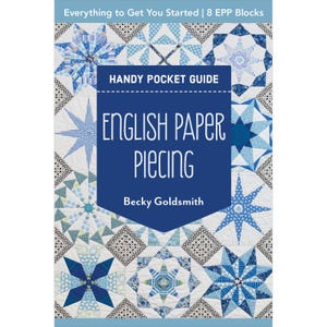 May include: A book cover titled "English Paper Piecing" by Becky Goldsmith. The cover features a navy blue central panel with white text and is surrounded by a patchwork quilt design in shades of blue and white. The text "Handy Pocket Guide" is also visible.