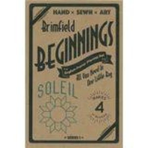 May include: A rectangular tan cardboard package labeled Brimfield Beginnings, Hand Sewn Art, English Paper Piecing Set, All You Need In One Little Bag, Soleil, and Makes 4 Blocks. The design features black text and a sun-shaped geometric graphic.