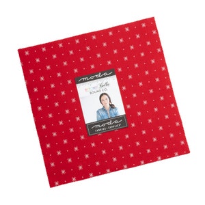 May include: Red fabric with a white crosshatch pattern. The fabric is labeled "moda Beyond Bella Bound Co."