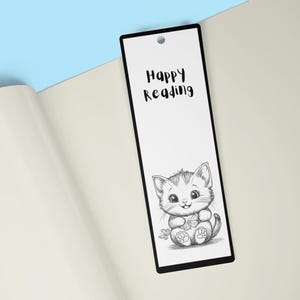 May include: Black and white bookmark with a cute cartoon cat holding a flower. The bookmark has the text "Happy Reading" on it.
