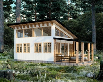 Peut inclure: Un chalet moderne blanc avec une grande baie vitrée et une terrasse en bois. Le chalet est entouré d'arbres et est situé dans une zone herbeuse. Le texte "Tiny Living Designs" est visible en bas de l'image.