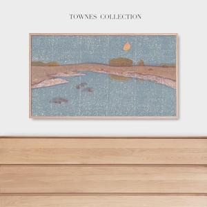 May include: A framed abstract landscape painting with a blue, brown, and yellow colour scheme. The painting depicts a body of water with a reflection of the sky and a yellow sun. The painting is hanging above a wooden dresser with four drawers.