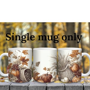 May include: A white ceramic mug featuring a wrap-around illustration of autumn harvest elements including pumpkins, grapes, wheat, and maple leaves in shades of brown and orange. The text "Single mug only" is printed in black above the mug.