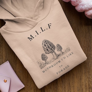 Discover the Enchanted Forest Forager MILF Hoodie for Morel Mushroom Enthusiasts | Mushroom Hunting, Foraging, and Morel Hunting Apparel