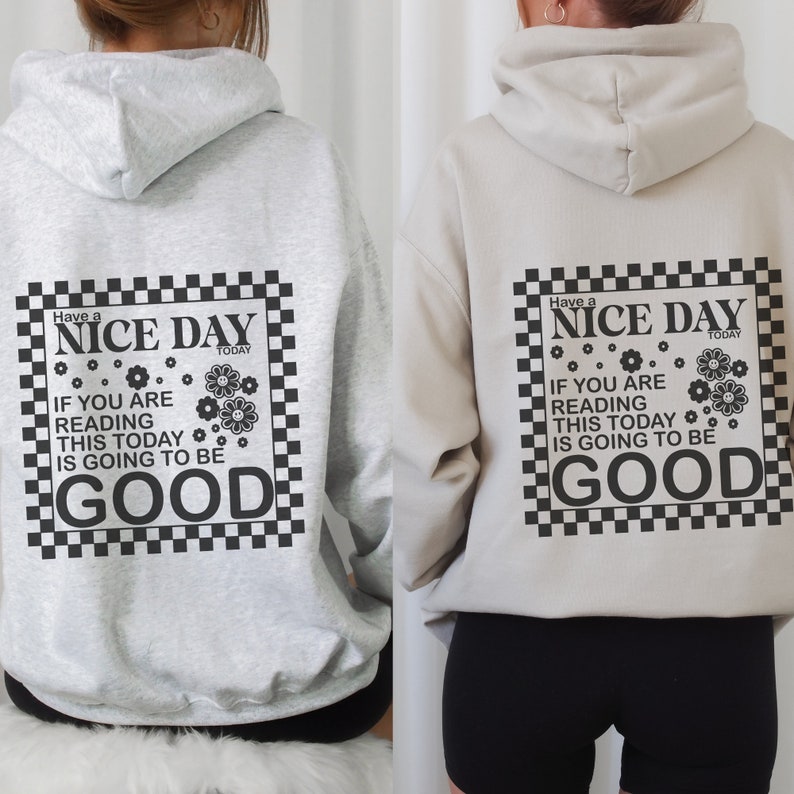 May include: Grey and beige hooded sweatshirts with a black and white chequered graphic print that says "Have a Nice Day Today. If you are reading this today is going to be good."