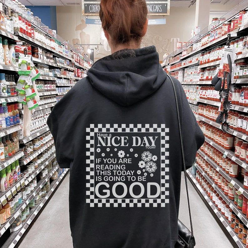 May include: Black hoodie with a white checkered graphic that says "Have a Nice Day Today. If you are reading this today is going to be good."
