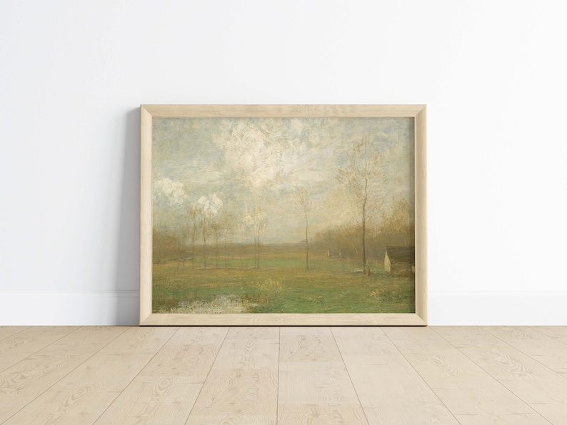 Puede incluir: Una pintura enmarcada que representa una escena de paisaje con una peque&ntilde;a casa blanca en la distancia. La pintura presenta un campo de hierba verde con &aacute;rboles que bordean los bordes. El cielo es de un azul claro con nubes blancas.