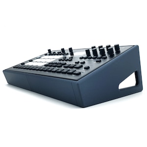 May include: A dark blue synthesizer with a black keyboard and knobs. The synthesizer has a built-in stand.