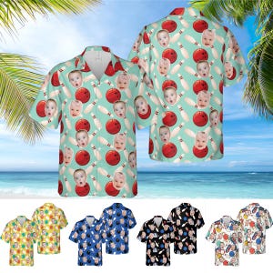 May include: Short-sleeved button-down shirt with a bowling-themed pattern. The shirt features a light teal background with red bowling balls, white bowling pins, and baby faces. Additional shirts with similar patterns are displayed below.