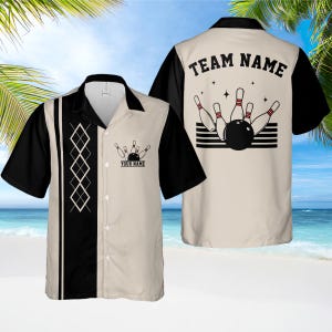 May include: Bowling shirt with a cream-colored body, black sleeves, and a black collar. The front features a diamond pattern and a bowling pin graphic with the text "YOUR NAME". The back displays "TEAM NAME" above a bowling pin and ball graphic.