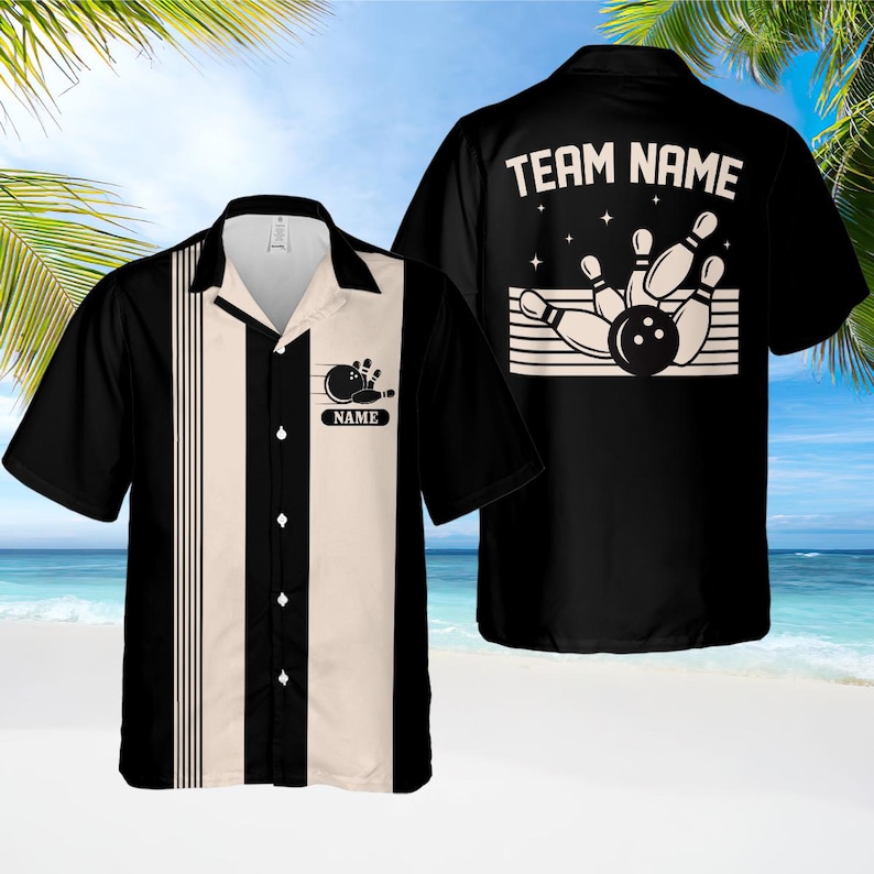 May include: Black and cream bowling shirt with a bowling pin and ball graphic. The shirt has a button-down front and a collared neckline. The back of the shirt features the text "TEAM NAME" above a bowling graphic.