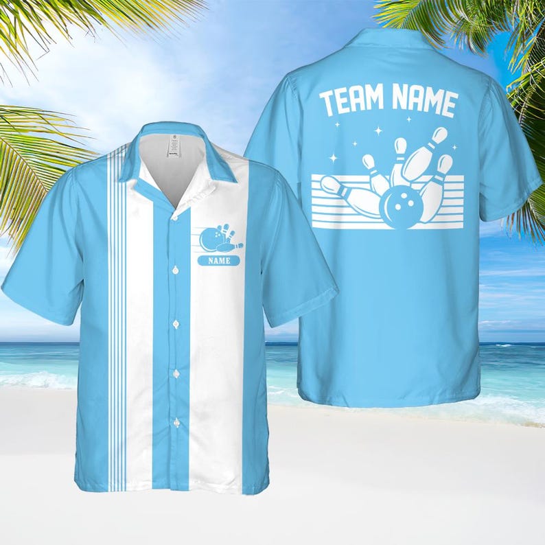 May include: Light blue bowling shirt with white vertical stripes and a bowling pin graphic. The shirt has a button-down front and a collar. The back of the shirt features the text "TEAM NAME" above a bowling pin design. The shirt is short-sleeved.