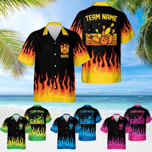 May include: A black, yellow, and orange Hawaiian shirt with a bowling ball and pins design. The shirt has the text "TEAM NAME" and "NAME" on it. The shirt is shown on a model against a beach background.