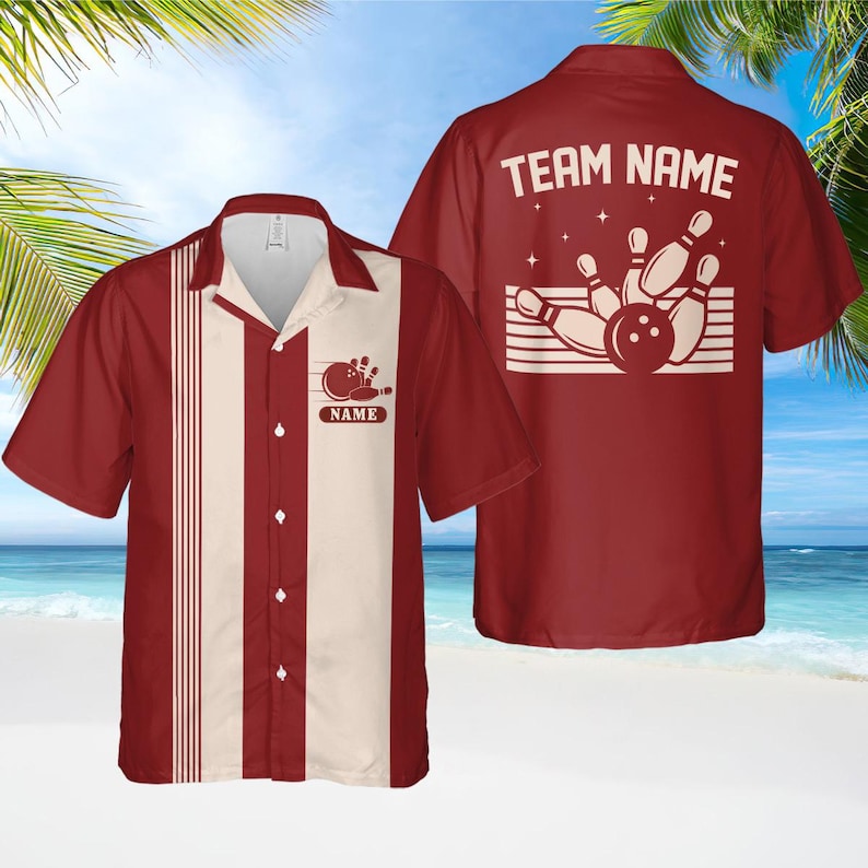 May include: Burgundy bowling shirt with cream-coloured vertical stripe. The shirt has a bowling pin and ball graphic with the word "NAME" on the front and "TEAM NAME" on the back. Short-sleeved, with a classic collar.