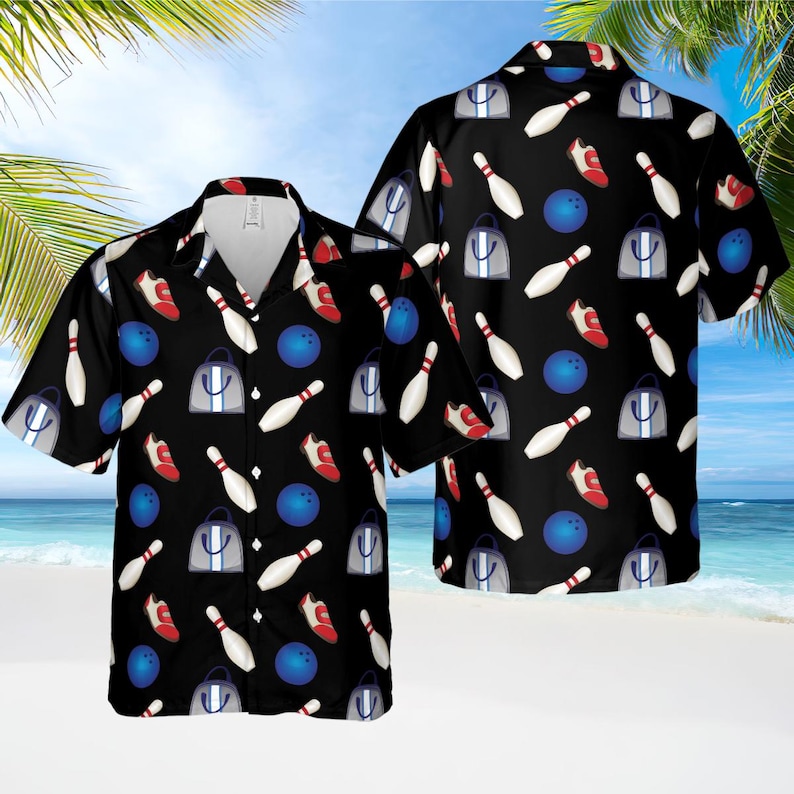 May include: Black short-sleeved button-down shirt with a bowling-themed pattern. The design includes white bowling pins, blue bowling balls, red bowling shoes, and gray tote bags. The shirt is a casual wear item.