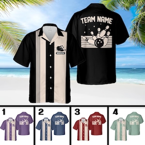 May include: Bowling shirts in black, white, and beige with a bowling ball and pins graphic. The shirts have a button-down front and short sleeves. The back of the black shirt has the text "TEAM NAME" above a bowling graphic. Additional shirts in purple, blue, red, and green.