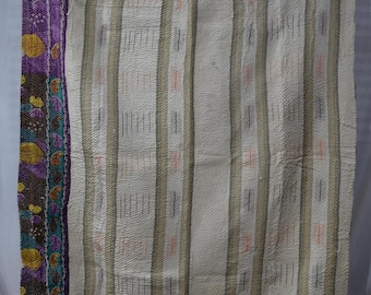 May include: A vintage kantha quilt with a white background and colorful stripes. The quilt has a decorative border with floral and paisley patterns in shades of purple, brown, yellow, and teal.