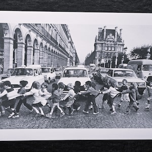 Robert Doisneau "Pinafores on Rue de Rivoli, Paris, 1978" On the back ©2014 Atelier Robert Doisneau Dimensions: 25.5 x 33.5 cm.