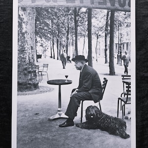 Robert Doisneau "Prévert at a Café Table, Paris, 1955" On the back ©2014 Atelier Robert Doisneau Dimensions: 25.5 x 33.5 cm.