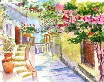 May include: Watercolor painting of a narrow street in a village with white buildings, a stone staircase, and a tree with pink flowers. The scene is painted in soft, muted colors.