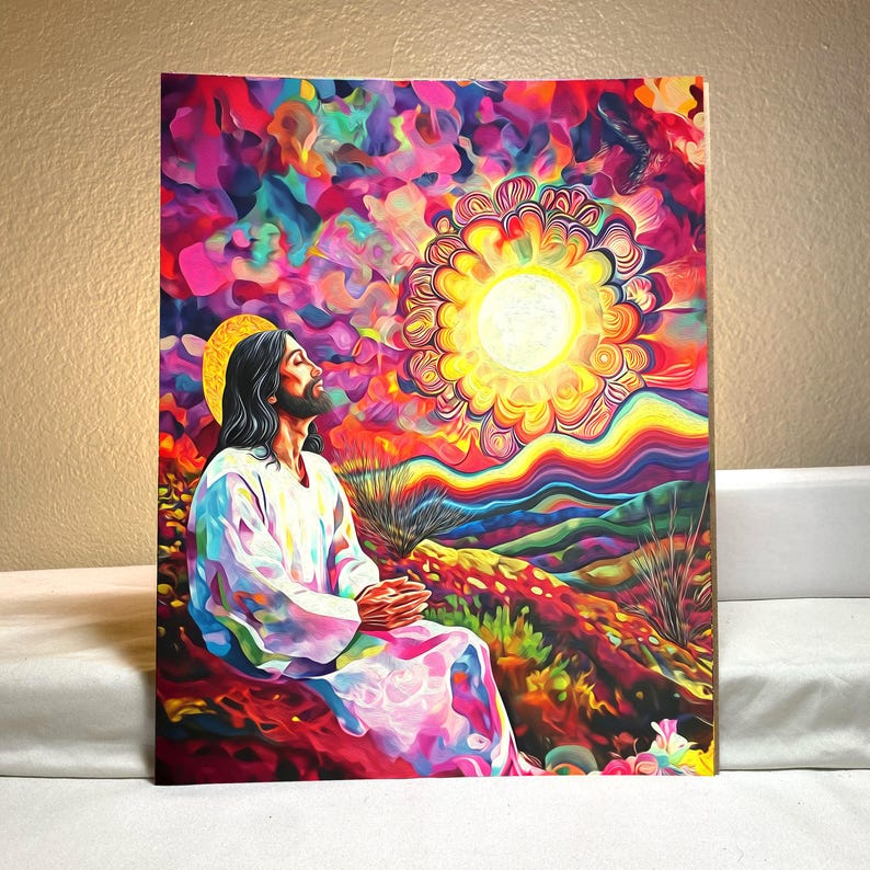 May include: A colorful painting of Jesus Christ in a white robe, with a halo, looking up at a bright sun with a rainbow background.