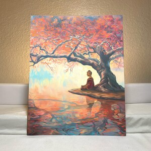 May include: A painting depicting a meditating Buddha figure seated beneath a large, pink-hued tree, with a reflection of the scene in the water below.