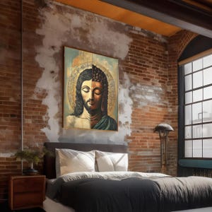 May include: A framed artwork depicting a split image of Jesus and Buddha, hanging above a bed with white pillows and a dark gray comforter. The room features exposed brick walls, a wooden nightstand, and a large window.