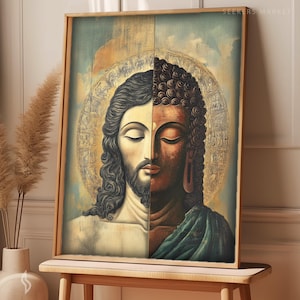 May include: A framed art print featuring a split image of Jesus and Buddha. The left side depicts Jesus with long hair and a beard, while the right side shows Buddha. The background has a golden halo and a celestial design. The artwork is displayed on a wooden table.