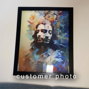 May include: A framed abstract painting of two people with long hair, one with a beard, against a colorful background of blue, green, and yellow.