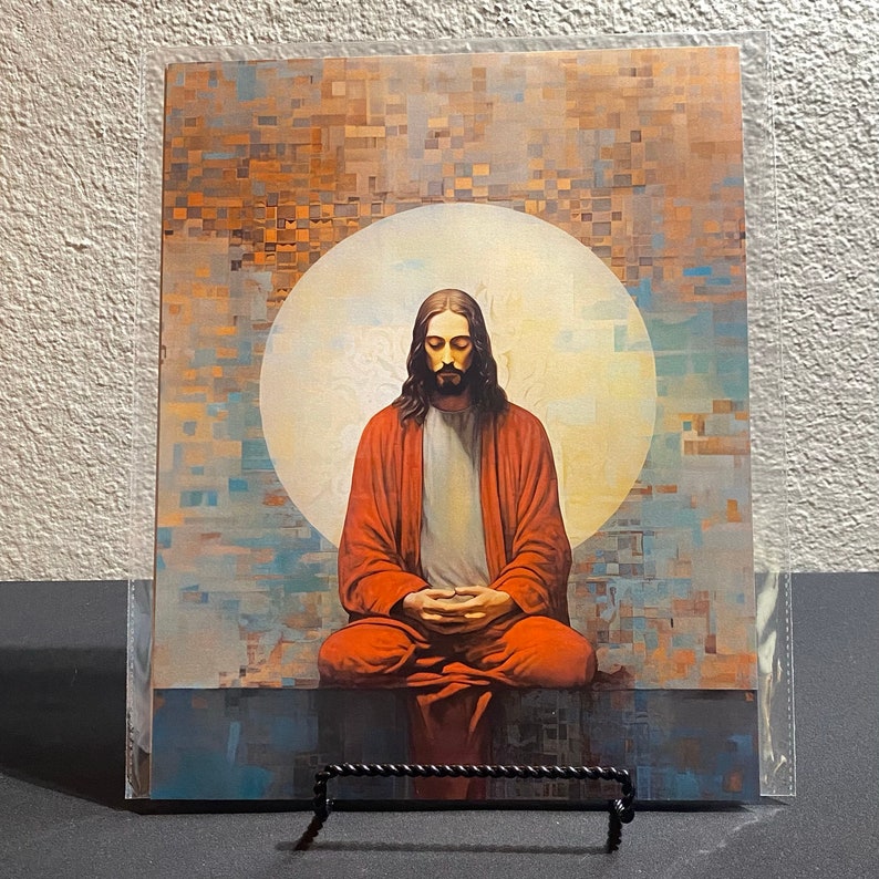 May include: A painting of Jesus in a red robe, meditating with his eyes closed. He is sitting in front of a large, white circle.