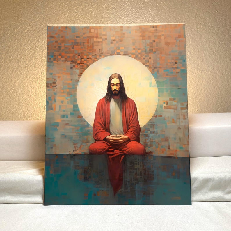 May include: A painting depicting a man in a red robe seated in a meditative pose with his eyes closed. He is surrounded by a white halo and a background of colourful geometric shapes.