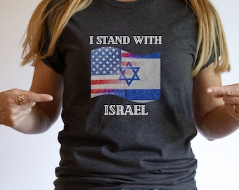 May include: A dark grey t-shirt with the text "I Stand With Israel" and an image of the American and Israeli flags.