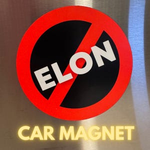 May include: A red circle with a diagonal line through it. The circle has a black background with the word "ELON" written in white letters. The text "CAR MAGNET" is written in yellow below the circle.