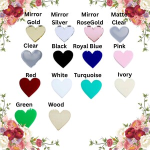 May include: A collection of heart-shaped ornaments in various colors and finishes. Options include mirror gold, silver, rose gold, clear, black, royal blue, pink, red, white, turquoise, ivory, green, and wood. Text labels identify each color.