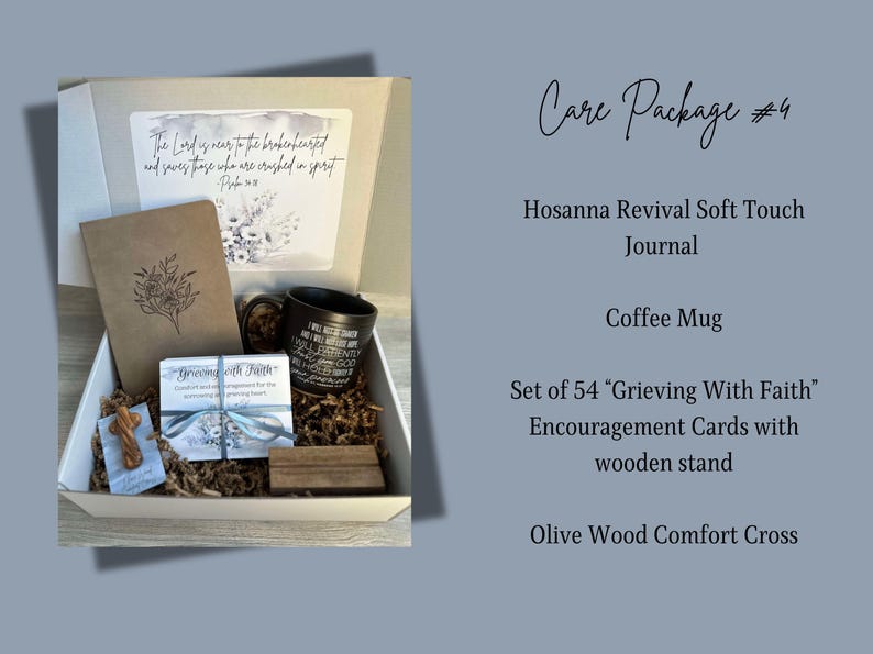 May include: A white gift box filled with a brown journal, a black coffee mug, a set of 54 encouragement cards, a wooden cross, and brown shredded paper. The box has a quote on the lid: "The Lord is near to the brokenhearted and saves those who are crushed in spirit."  Psalm 34:18