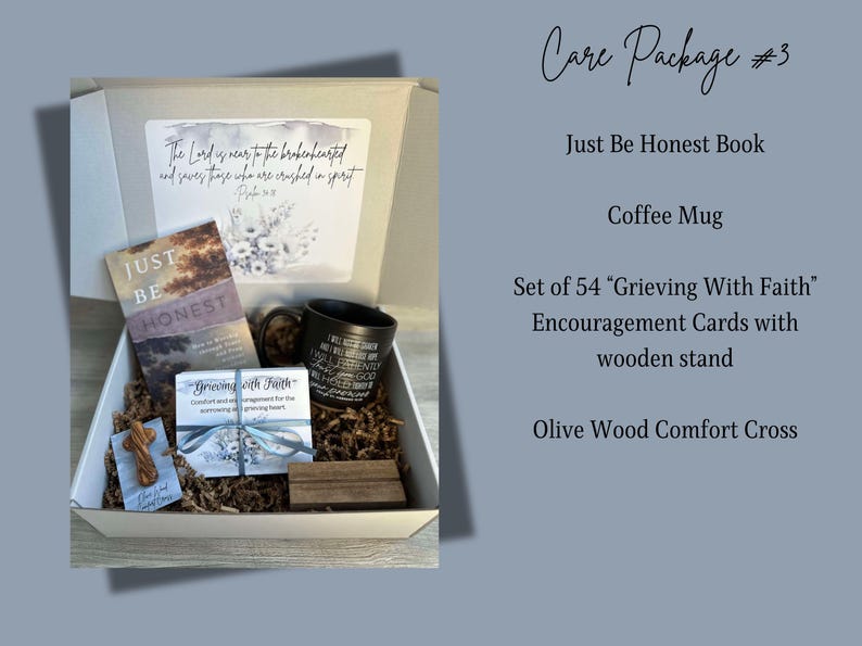 May include: A care package containing a black coffee mug, a book titled "Just Be Honest", a set of 54 encouragement cards with a wooden stand, and a small olive wood cross. The package is presented in a white box with brown packing paper.