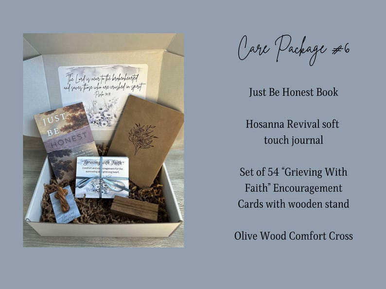 May include: A care package containing a brown box filled with items including a book titled "Just Be Honest", a soft touch journal, a set of 54 encouragement cards with a wooden stand, and a wooden cross. The box is decorated with a scripture verse.