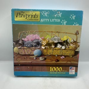 May include: A set of three ceramic mugs with a speckled, matte finish. The mugs are in shades of cream, light gray, and dark gray. Each mug has a simple, minimalist design and a rounded handle.