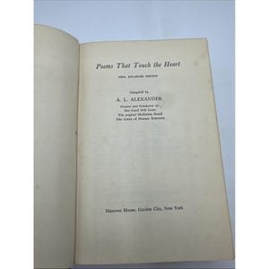 May include: Open book with the title "Poems That Touch the Heart" in black text. The book is an enlarged edition, compiled by A. L. Alexander. The text also mentions The Good Will Court and The Court of Human Relations. The publisher is Hanover House, Garden City, New York.