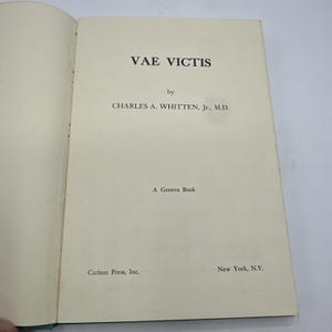 May include: The title page of a book titled Vae Victis by Charles A. Whitten, Jr., M.D. The page includes the text A Geneva Book and the publisher information Carlton Press, Inc., New York, N.Y. printed in black ink on an off-white paper page.