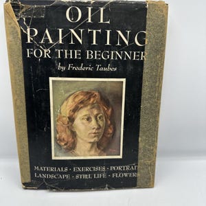 May include: A vintage book titled "Oil Painting for the Beginner" by Frederic Taubes. The cover is black with white lettering and features a portrait painting. Additional text includes "Materials, Exercises, Portrait, Landscape, Still Life, Flowers."
