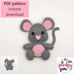 May include: A gray felt mouse with pink ears, nose, and belly, and a long tail. The mouse has black button eyes and is stitched with gray thread. The image includes the text "PDF pattern instant download" and paw prints.
