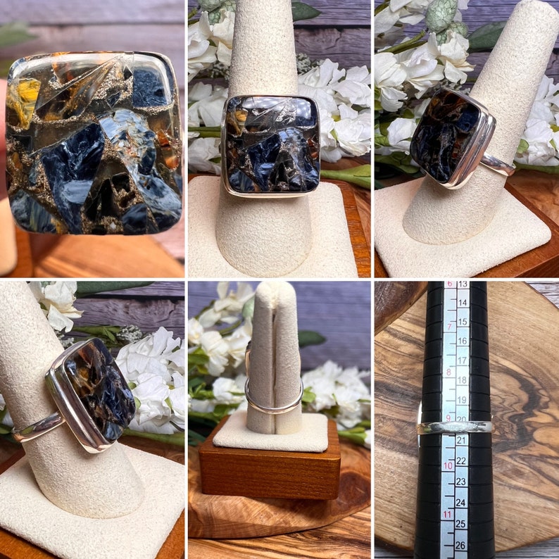 May include: A silver ring featuring a square-shaped blue and brown tiger's eye gemstone. The ring size is measured using a ring sizer.