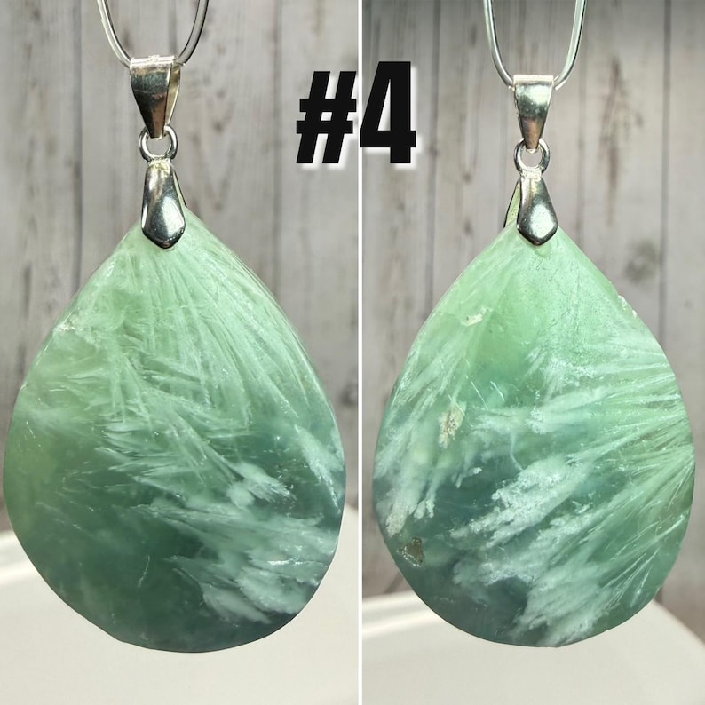 May include: A green gemstone pendant necklace with a teardrop shape and white veining. The pendant hangs from a silver chain. The number "#4" is displayed in black text in the upper right corner.