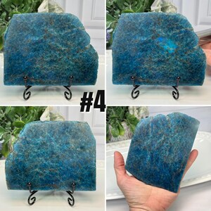 May include: Four images of a blue apatite slab with a rough, natural edge. The stone has a mottled appearance with shades of blue and brown. The slabs are displayed on black metal stands and one is held in a hand. The text "#4" is visible.