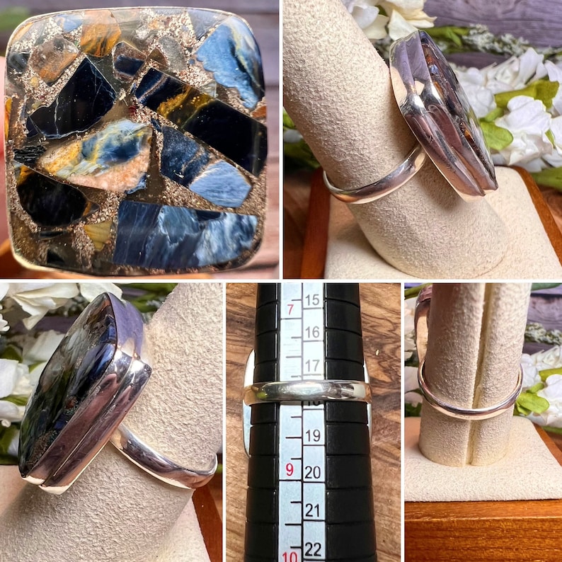 May include: A silver ring with a square blue and gold tiger's eye stone. The ring is size 20.