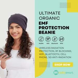 May include: A woman wearing a dark gray beanie, holding a smartphone, smiles at the camera. The image includes text that reads "ULTIMATE ORGANIC EMF PROTECTION BEANIE" and details about wireless radiation protection.